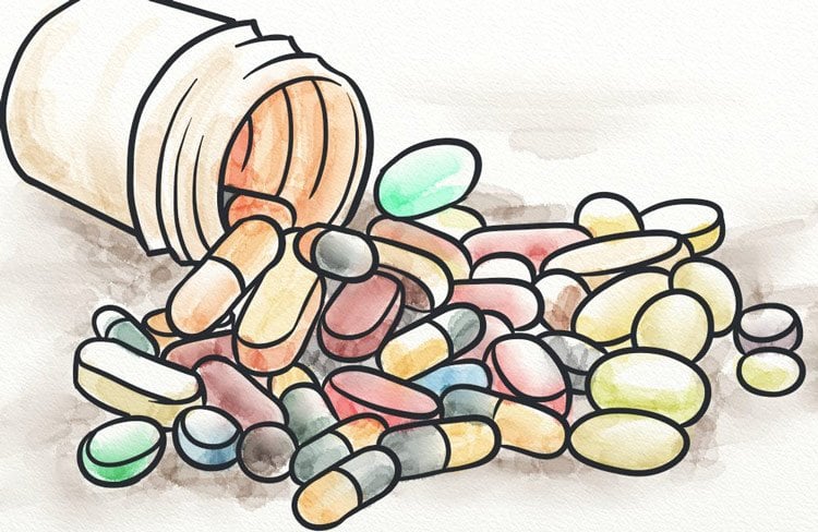 Various different vitamins spread across a table